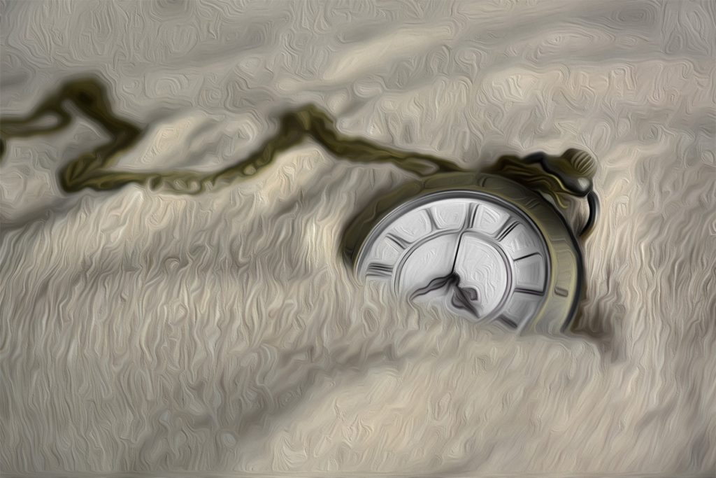 image of a pocket watch being buried by the sand of time illustrating the fleeting nature of life